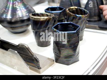 Decorative vase created using 3D metal printing. Metal model printed on 3D printer. Additive manufacturing from melted metal thread. Additive manufacturing. Object printed on 3D printer from metal Stock Photo