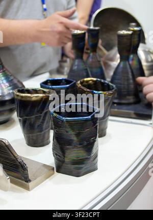 Decorative vase created using 3D metal printing. Metal model printed on 3D printer. Additive manufacturing from melted metal thread. Additive manufacturing. Object printed on 3D printer from metal Stock Photo