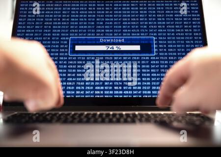 Finger typting on a laptop computer, download progress bar on the screen, download of data. Finger typting on a laptop computer, download progress bar Stock Photo