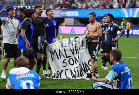 Argentina players hold up a banner with the words 'Las Malvinas son Argentinas' following victory in the FIFA World Cup 2026 semi-final match at the Atlanta Stadium. Downing Street has backed a minister’s call for Fifa to investigate whether Argentina players broke rules by waving a banner in support of their country’s claims to the Falkland Islands, saying: “The World Cup might not be ours, but the Falkland Islands definitely are.” Picture date: Wednesday July 15, 2026. Stock Photo
