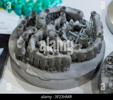 3D-printed metal frames for dental prostheses. Metal frames for dental crowns and bridges, printed on 3D printer using selective laser melting SLM technology. Additive modern manufacturing technology Stock Photo