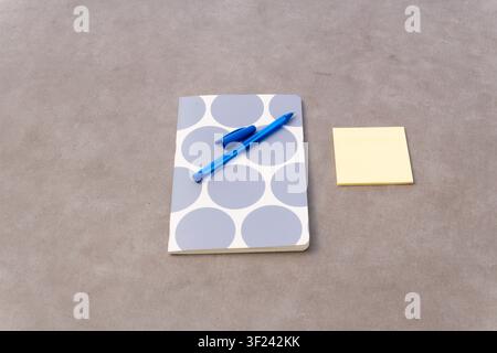 Notebook, pen, and sticky notes composing a minimalist scene for education, business, and creative planning Stock Photo