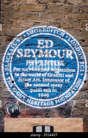 A painted spoof blue plaque in Shoreditch, London, commemorating Ed Seymour, inventor of the aerosol spray paint can in 1949. Stock Photo