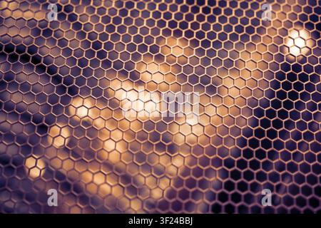 A close-up image showcasing a hexagonal glass surface pattern with intricate geometric design, creating an abstract and modern visual effect suitable Stock Photo