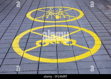 No cycling traffic transport sign on the ground of public park pavement Stock Photo