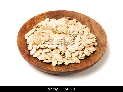 Whole Pumpkin Seeds in Shell Isolated, Raw Pepita Grains, Scattered Green Healthy Nuts, Pumpkin Seed with Skin on White Background Stock Photo