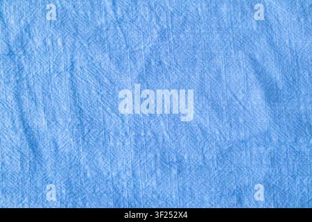 Blue textured fabric background with subtle wrinkles and soft linen look for design projects Stock Photo