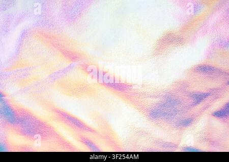 Iridescent pastel foil background with soft metallic texture and dreamy holographic shimmer Stock Photo