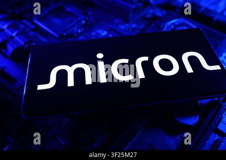 Micron Logo Displayed on Computer Chip Circuit Board CPU Motherboard Representing Memory Semiconductor and Data Storage Technology Innovation Stock Photo
