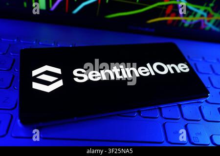 SentinelOne Cybersecurity and Artificial Intelligence Threat Detection Company Logo on Smartphone With Stock Market Performance Chart Stock Photo