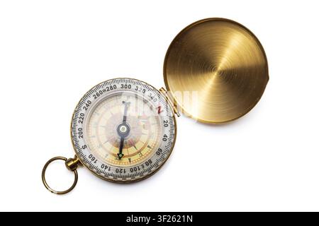 Open vintage brass pocket compass isolated on white background Stock Photo