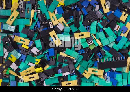 Circuit board jumper caps plastic computer components scattered loosely. Stock Photo