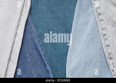 Denim fabric texture background with various shades of blue and gray jeans material, textile industry concept, this composition highlights the textile Stock Photo