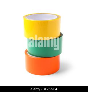 Stack of three colorful adhesive tape rolls in yellow, green, and orange for packaging and crafting Stock Photo