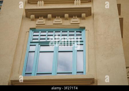 Window design on a building with light blue frames Stock Photo