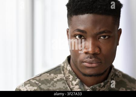 Serious Young Black Male In Military Jacket Looking Confident With Intent Focused Expression Stock Photo