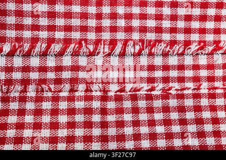 Macro texture of red and white fabric threads background with selective focus and copy space High quality Stock Photo