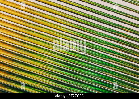 Abstract diagonal lines creating green and gold pattern Stock Photo