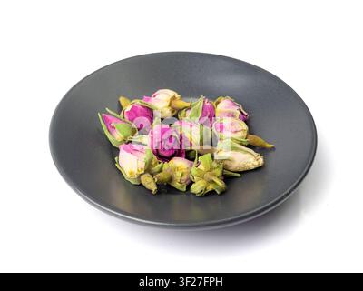 Dry Rose Buds, Roses Petals for Pink Flower Tea, Dried Persian Rosebuds, Rose Buds Textured Flowers Isolated on White Background Stock Photo