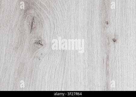 Horizontal close up overhead view of a light grey wood texture with a natural oak pattern and rustic timber board knots for minimalist interior design Stock Photo