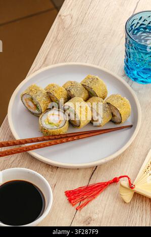 Deep fried tempura sushi rolls on a plate Stock Photo