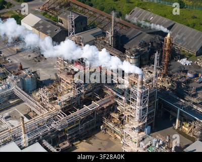 Aerial view of the Tronox chemical production factory with a prominent chimney emitting a smoke plume over industrial infrastructure in Stallingboroug Stock Photo