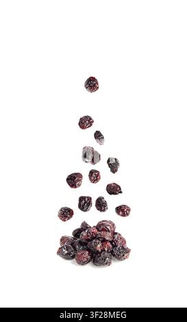 Dry Falling Cranberry Pile Isolated, Dried Flying Lingonberry Berries, Cowberry Natural Dessert, Healthy Diet, Organic Snack, Dry Cranberries on White Stock Photo