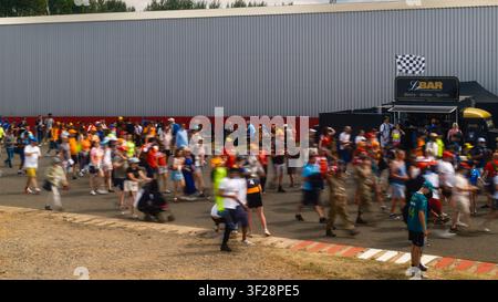 Fans heading to the British Grand Prix race on Sunday at Silverstone, with crowds walking through the circuit area before the start of the Grand Pri Stock Photo
