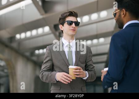 Businessmen Networking over Coffee during Break Stock Photo