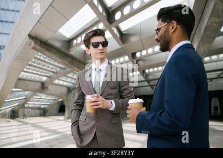Diverse Businessmen Networking over Coffee Outdoors Stock Photo