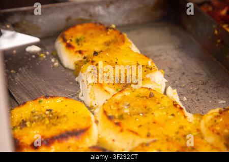 Ballaro Market Palermo street food stall with wine and assorted sicilian street food. Stock Photo