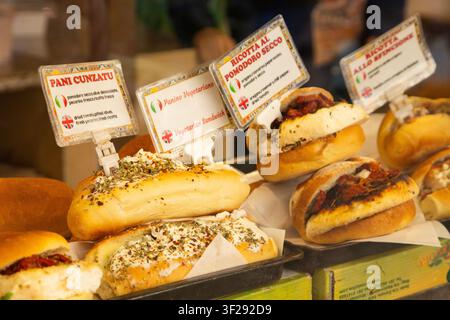 Ballaro Market Palermo street food stall with wine and assorted sicilian street food. Stock Photo