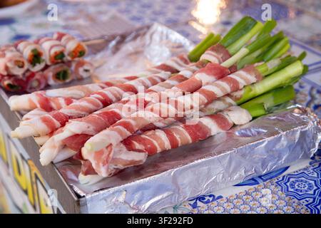 Ballaro Market Palermo street food stall with wine and assorted sicilian street food. Stock Photo