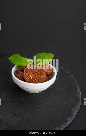 Dry Fig, Dried Ficus Carica Fruit, Sweet Healthy Diet, Tropical Dessert, Wrinkled Dehydrated Snack, Dry Figs on Black Background Stock Photo