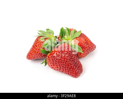 Three fresh strawberry in a row isolated, whole ripe straw berry line, red juicy imperfect strawberri with green leaves, natural delicious strawberry Stock Photo