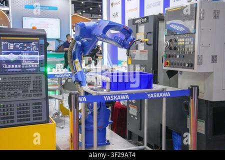 Bangkok, Thailand - June 17, 2026: A close-up view of a robotic arm gripper tool at an industrial automation booth during a manufacturing trade show. Stock Photo