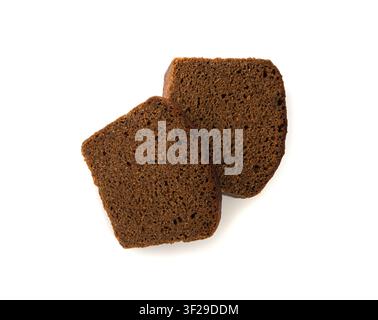 Black rye bread isolated, dark brown sliced loaf, sourdough borodinsky rugbrod square slices with coriander on white background Stock Photo