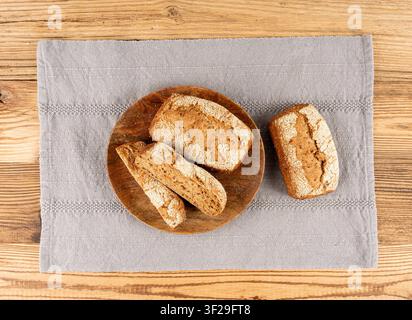 Whole wheat brown bread, fitness pumpkin carrot buns with seeds, cereal bread grain bun with rye on rustic background Stock Photo