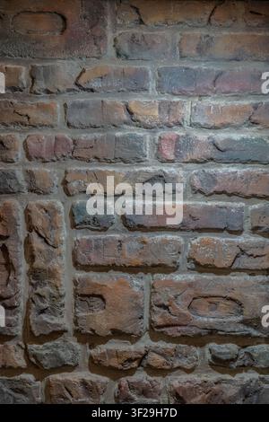 Old weathered brick wall texture background, rustic exposed brickwork with rough surface for interior design Stock Photo