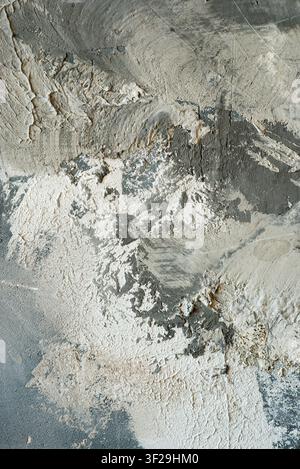 Abstract vertical grunge background with rough grey concrete and white decorative plaster wall texture. Stock Photo