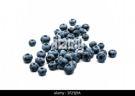 A heap of ripe fresh blueberries scattered on a clean white isolated background with soft shadow Stock Photo