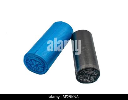 Blue and black trash bag rolls on white background Stock Photo