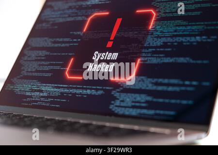 System hacked warning sign on a computer screen, data, code, encryption, computer crime. System hacked warning sign on a computer screen, data, code, Stock Photo