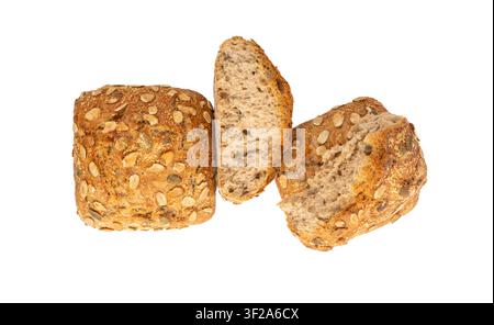 Pumpkin seeds broken bread isolated, three breakfast rolls with pepita seeds. Fitness square bun, crumbled healthy burger, zucchini seeds bun on white Stock Photo