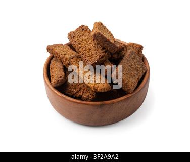 Rye Croutons in Wood Bowl Isolated, Homemade Brown Bread Rusks, Crispy Bread Cubes Scattered Pile, Dry Rye Crouoton Crumbs, Brown Roasted Salted Crack Stock Photo