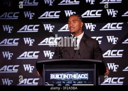 Wake Forest quarterback Gio Lopez (3) looks to pass under pressure from ...