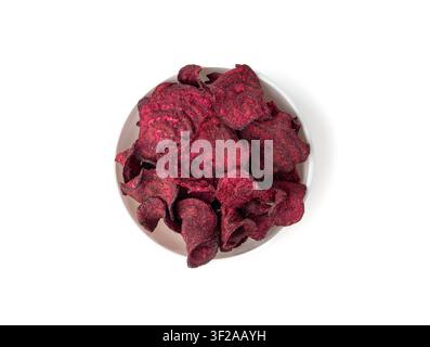 Dry beetroot chips isolated, dried sliced red beet flakes pile, beet root pieces and chips, dehydrated deep fried vegetable root heap on white backgro Stock Photo