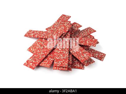 Beetroot crackers isolated, thin rusk beet root bread, red diet multigrain crispbread, various seeds whole grain crisp bread, long cracker on white ba Stock Photo