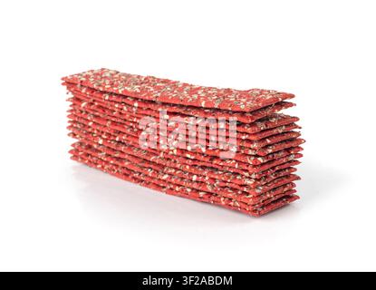 Beetroot crackers isolated, thin rusk beet root bread, red diet multigrain crispbread, various seeds whole grain crisp bread, long cracker on white ba Stock Photo