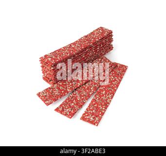Beetroot crackers isolated, thin rusk beet root bread, red diet multigrain crispbread, various seeds whole grain crisp bread, long cracker on white ba Stock Photo